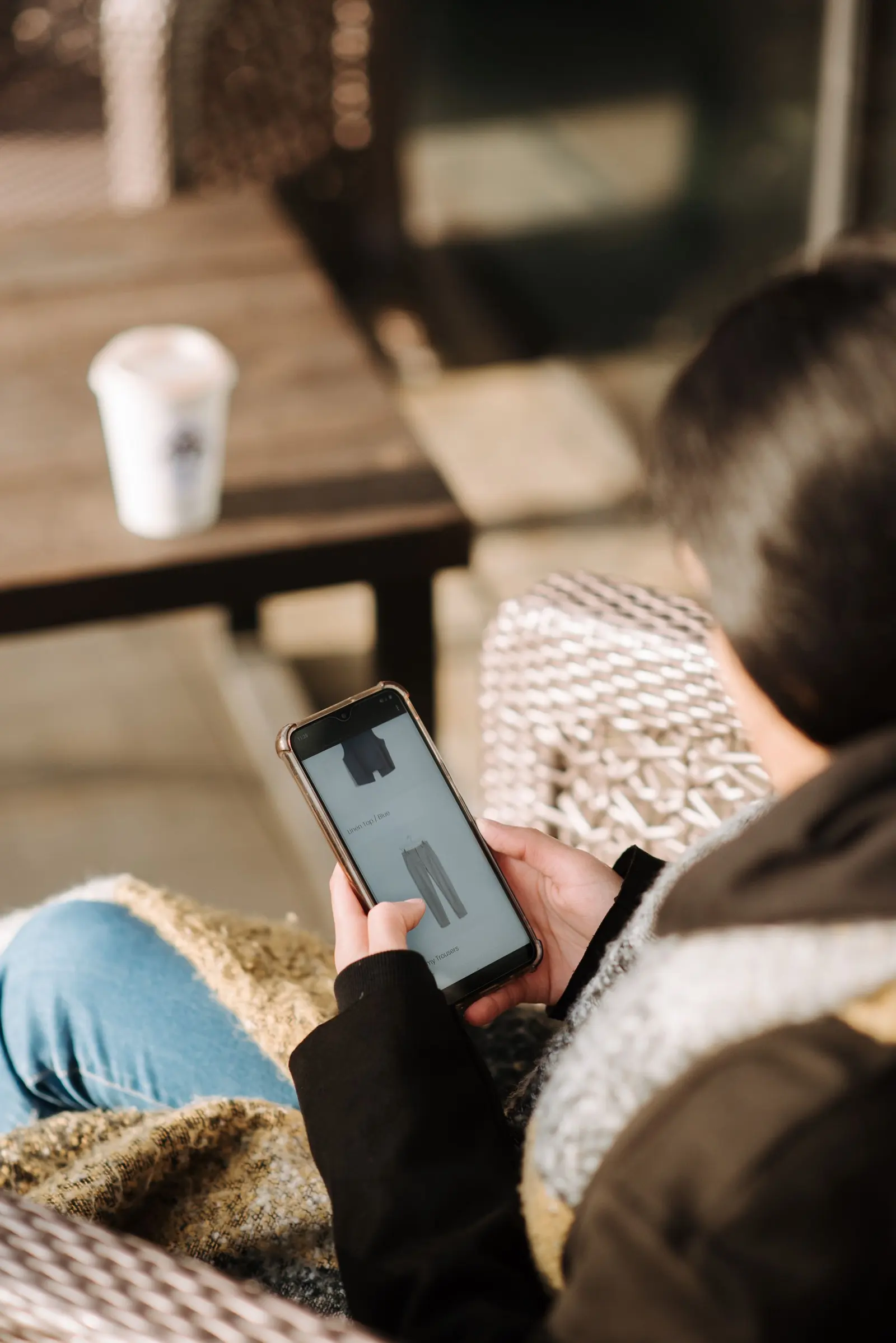 Shopper scrolling through products on her phone