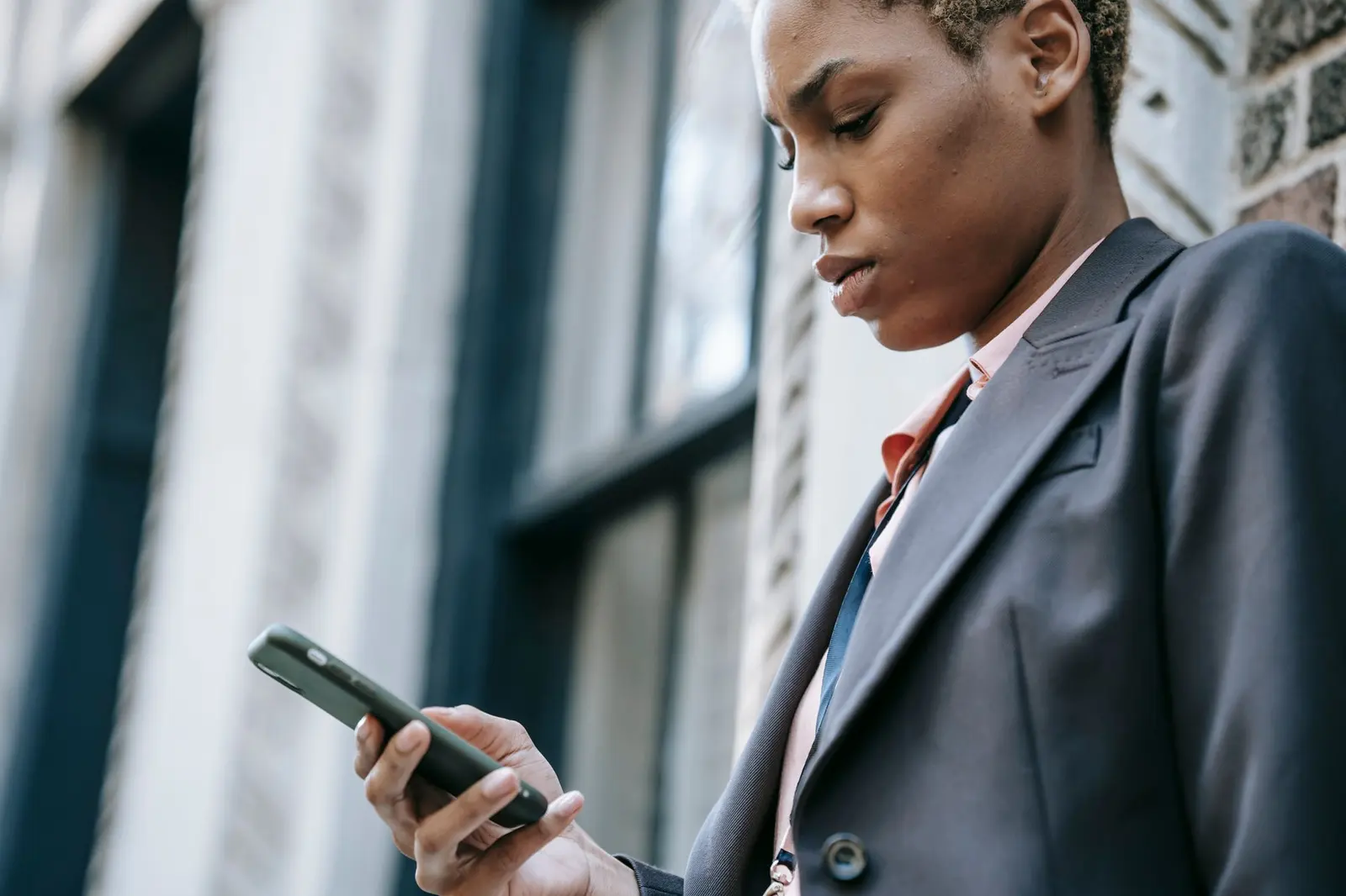 Business owner in Nairobi checking her business listing on Google from her phone