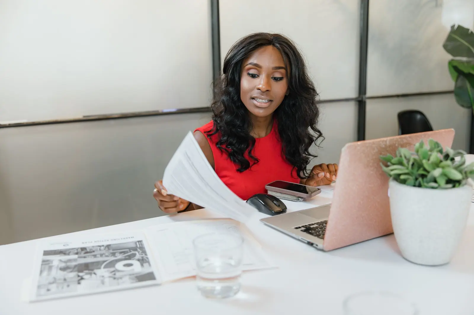 Business owner checking her website’s monthly numbers on a laptop