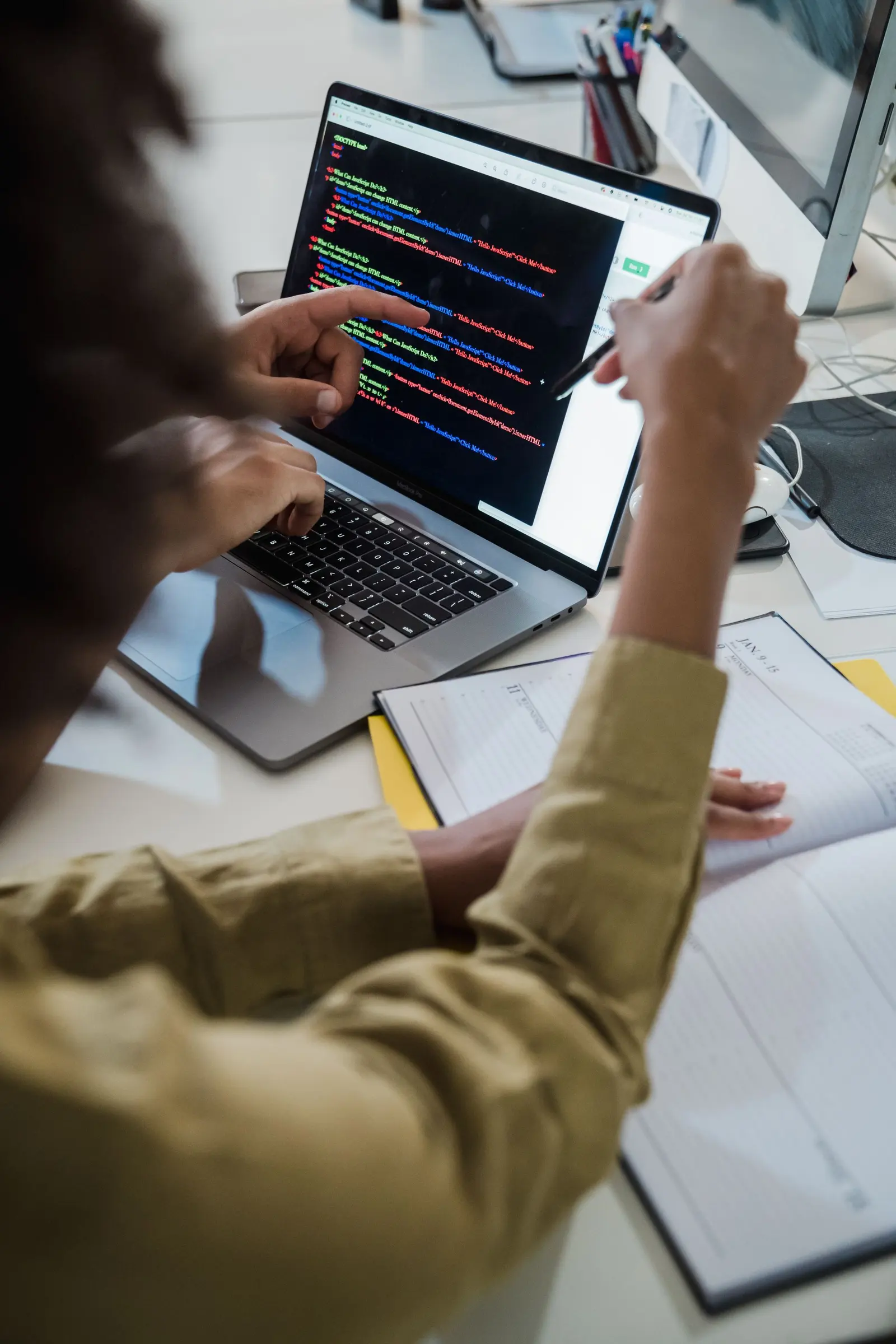 Developer writing integration code on a laptop