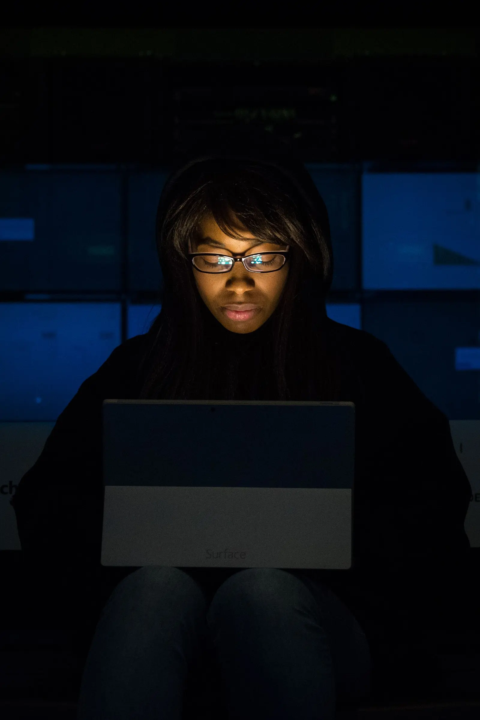 Business owner reviewing an automated research report late at night