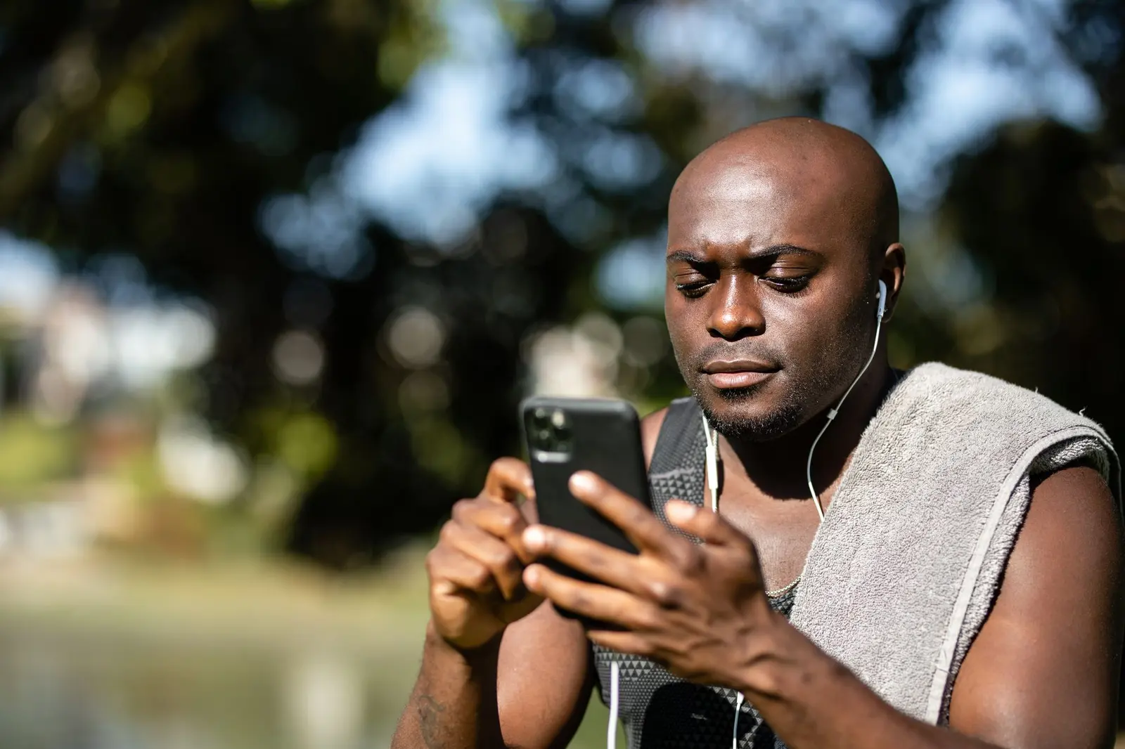 Business owner reading an instant alert on his phone
